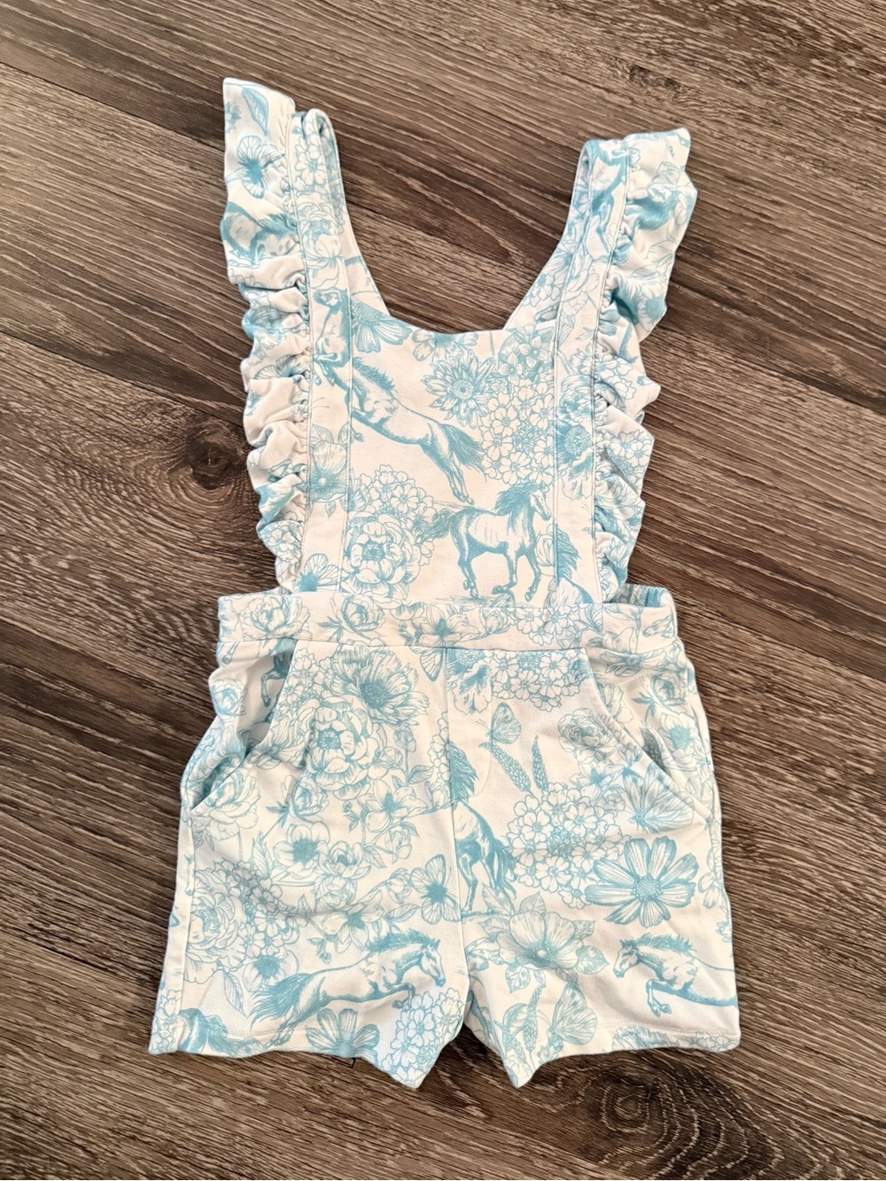 Posh Peanut Charlotte Anne blue and white horse-and-floral print flutter overall